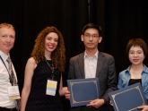 Dr Louis Wong(2nd right) and Ms Yahui Zhang (1st right) received the Best Paper Award from the ARMA President Dr. Joseph P. Morris (1st left) and the 53rd US Rock Mechanics / Geomechanics Symposium Co-Chair Dr Evangelia Ieronymaki (2nd left)